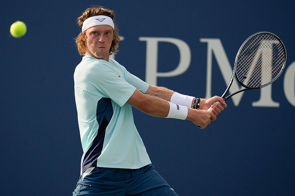| Photo: AP/Seth Wenig : Andrey Rublev returns a shot.